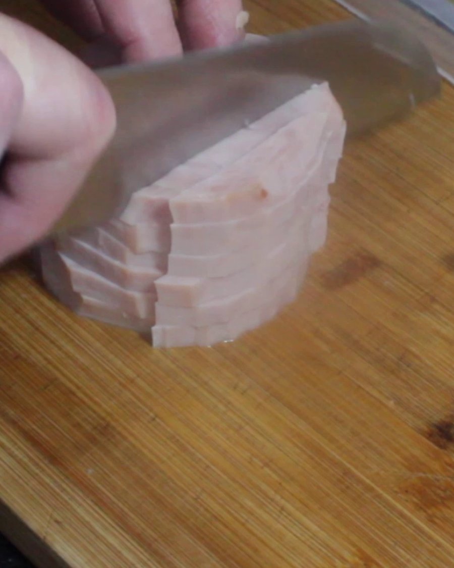 Slicing ham on a cutting board